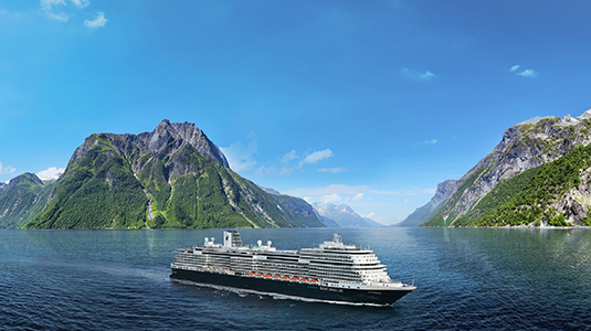 Cruise ship with mountains in the background